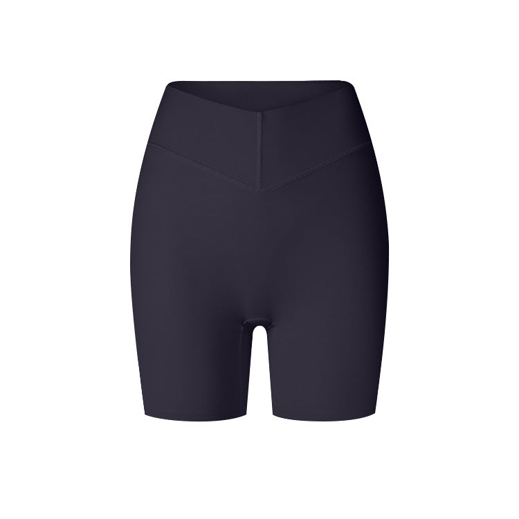 A product image featuring black high-waisted workout shorts with compressive fabric and V-shaped waistband against white background