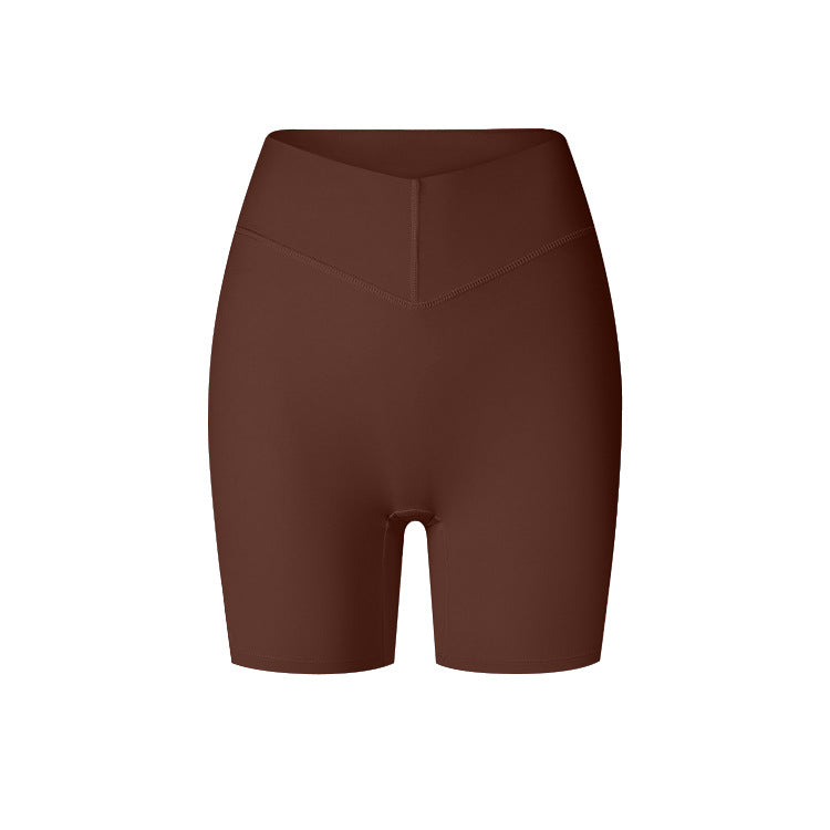 A product image showing brown high-waisted compression shorts with V-cut waistband and mid-thigh length against white backdrop