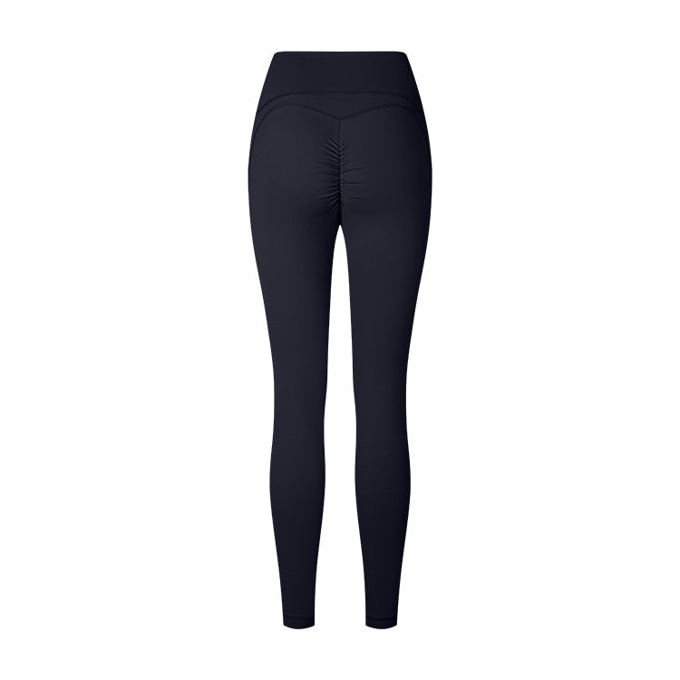 Product photo of black high-waisted athletic leggings with ruched back detail on white background