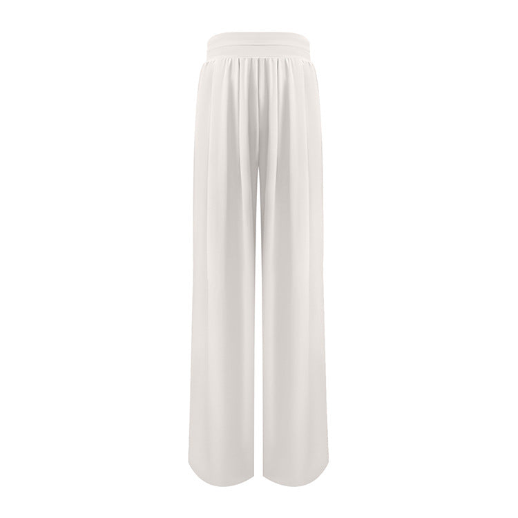 White wide-leg flowing pants with high waistband and pleats displayed against neutral background