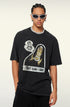 A model wearing white-framed sunglasses and a black graphic t-shirt with 'WHAT CAN I SAY' print. Features silver chain necklace and cornrow braids