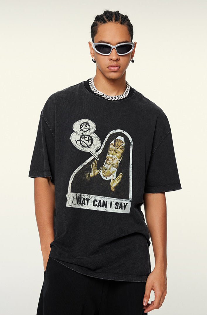 A model wearing white-framed sunglasses and a black graphic t-shirt with 'WHAT CAN I SAY' print. Features silver chain necklace and cornrow braids