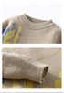 Close-up detail shots of beige knit sweater showing ribbed collar construction and fabric texture with blue and yellow motif