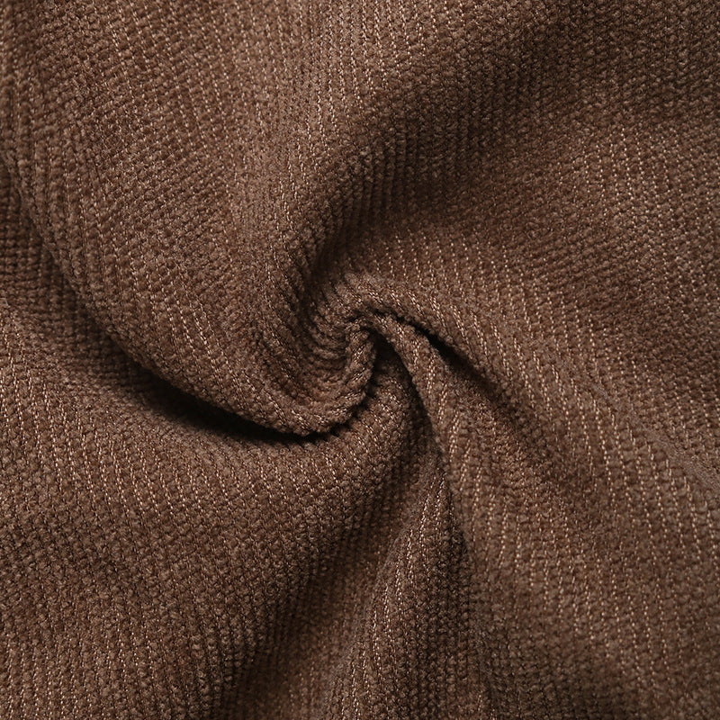 Swirled fabric of the brown pleated skort, showcasing the soft, suede-like texture.