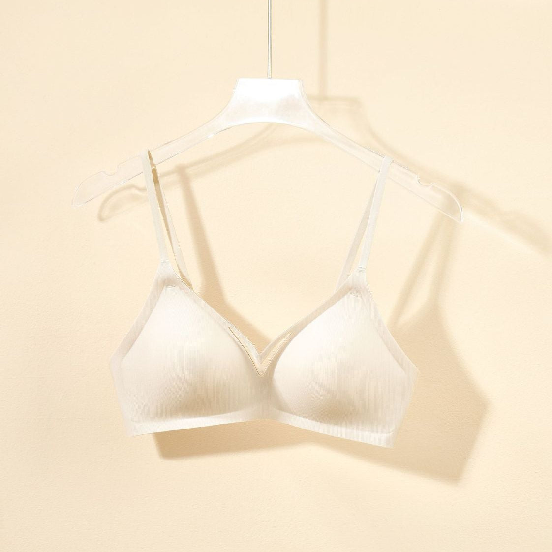 Lightweight soft cup bra displayed on a hanger, featuring a breathable, body-hugging fit.