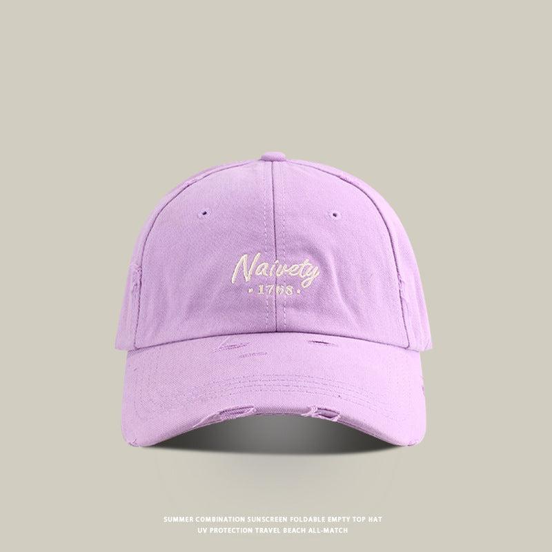 Light purple baseball cap with cream 'Naivety 1768' embroidered logo