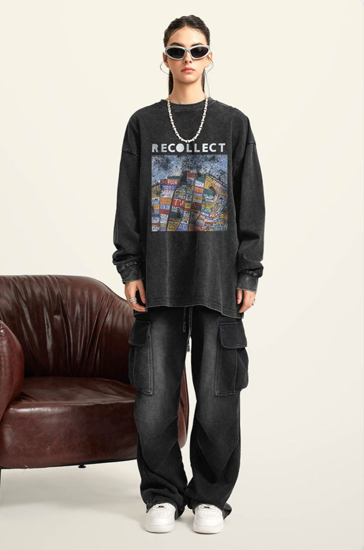 A female model wears a black "RECOLLECT" sweatshirt, black joggers, and white sneakers, posing with hands in pockets