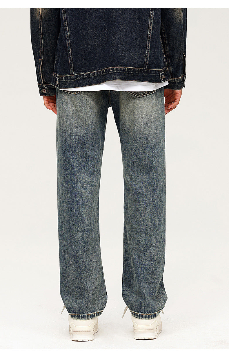 Back view of relaxed fit vintage wash jeans with straight leg silhouette and clean hem