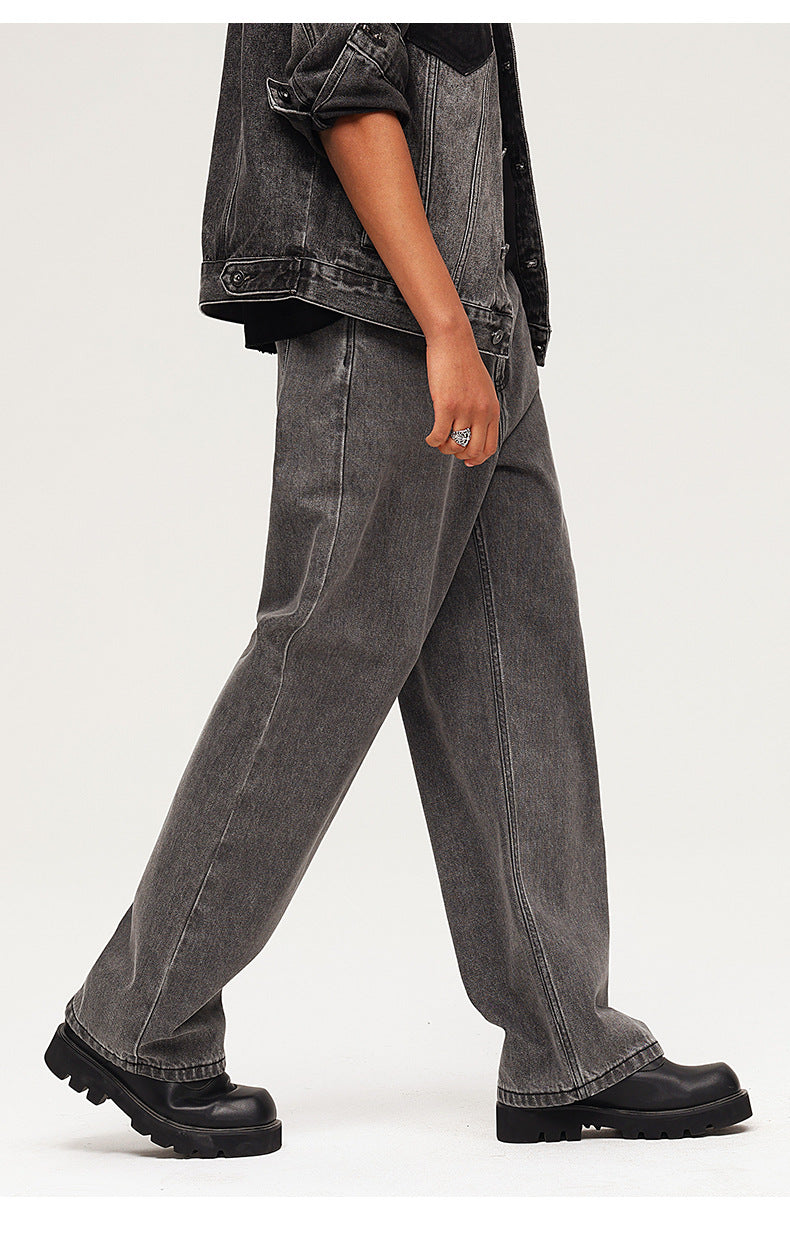 Side profile showing washed black wide-leg jeans paired with platform boots and jean jacket, emphasizing streetwear aesthetic