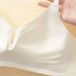 A detailed view of a white bra's soft, fixed cup lining, showing its smooth, skin-friendly fabric and gentle support.