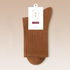 Caramel brown cotton sock with quality assurance tag in minimalist design
