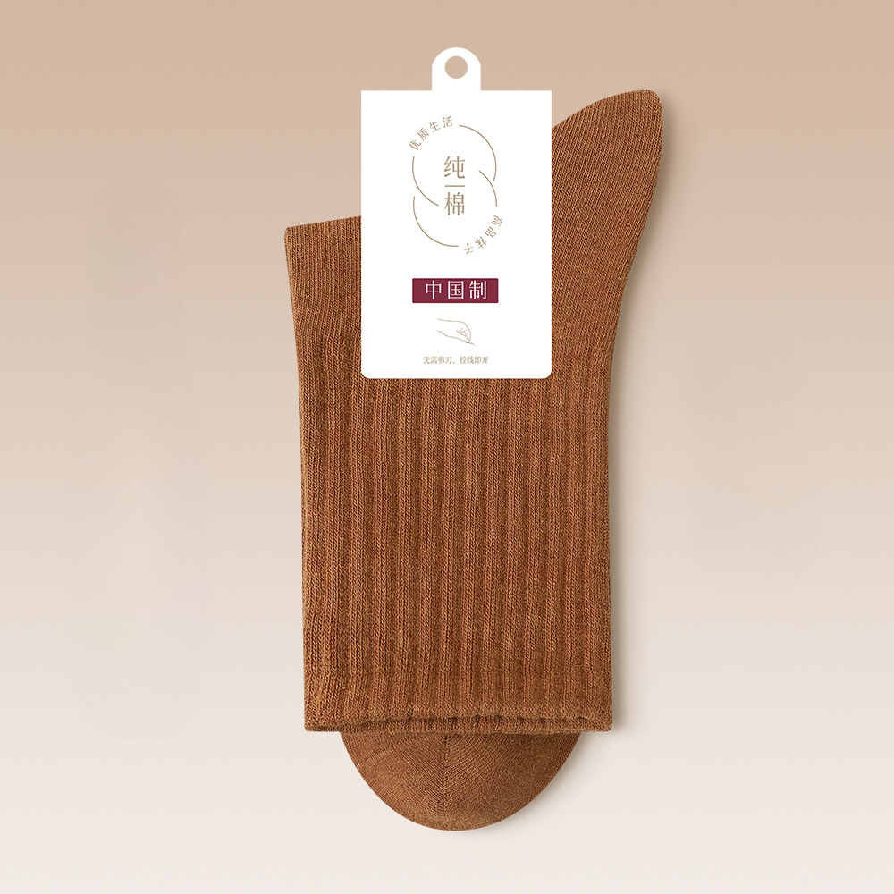 Caramel brown cotton sock with quality assurance tag in minimalist design