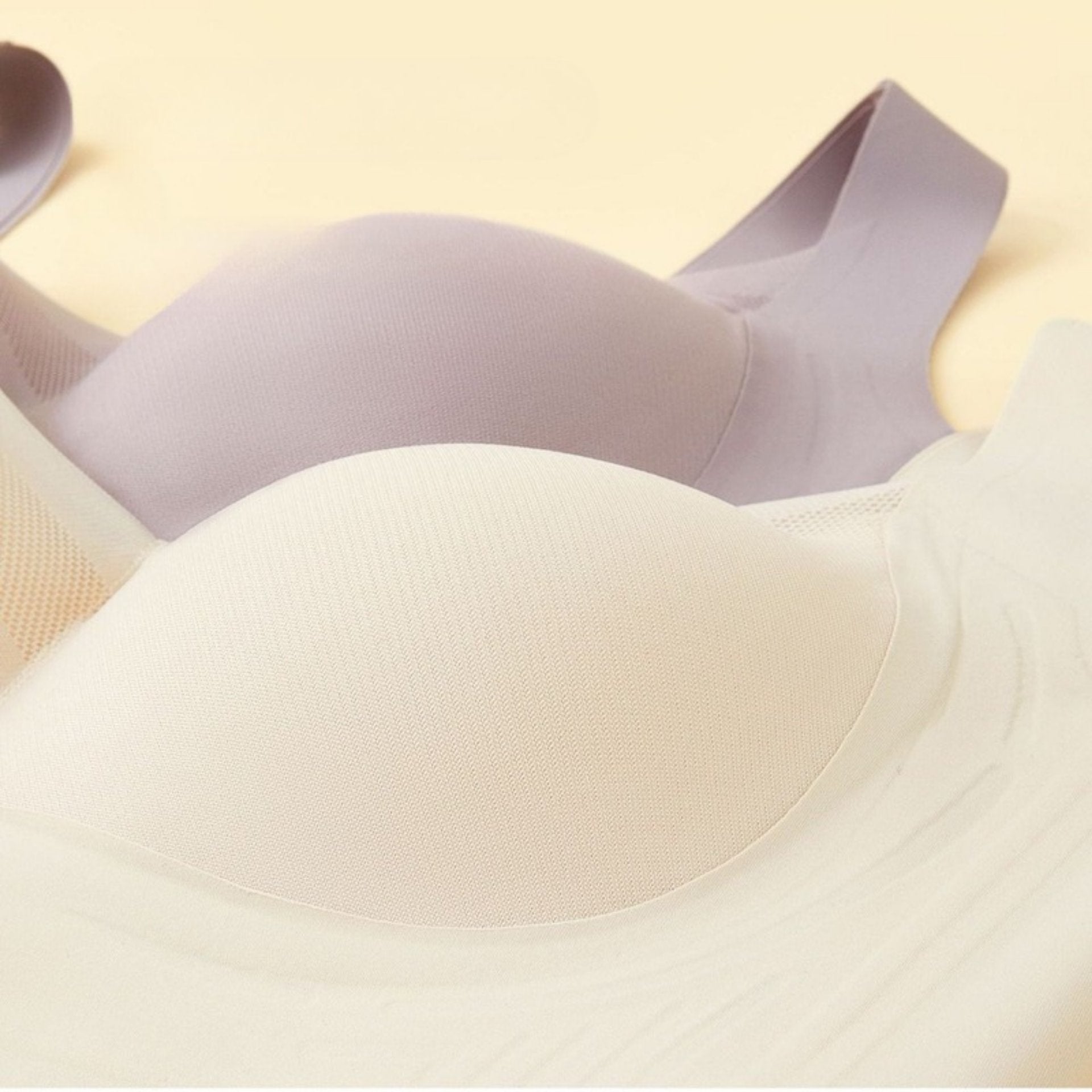 A beige and gray bra with 3D molded cups for full coverage and stable support without sagging.