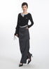 Full-length view of gray midi skirt with model showcasing elegant draping and high-fashion design