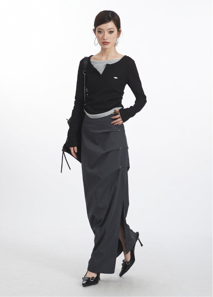 Full-length view of gray midi skirt with model showcasing elegant draping and high-fashion design