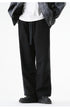 Black wide-leg pants with drawstring waist worn with a white t-shirt and gray leather jacket