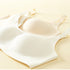 Close-up of seamless bras in cream and beige, highlighting smooth molded cups for natural shaping.