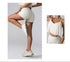 Model in white high-waisted compression shorts and ruffled crop top, showing leg raise pose with white sneakers" + "Close-up of white ruffle-trim crop top