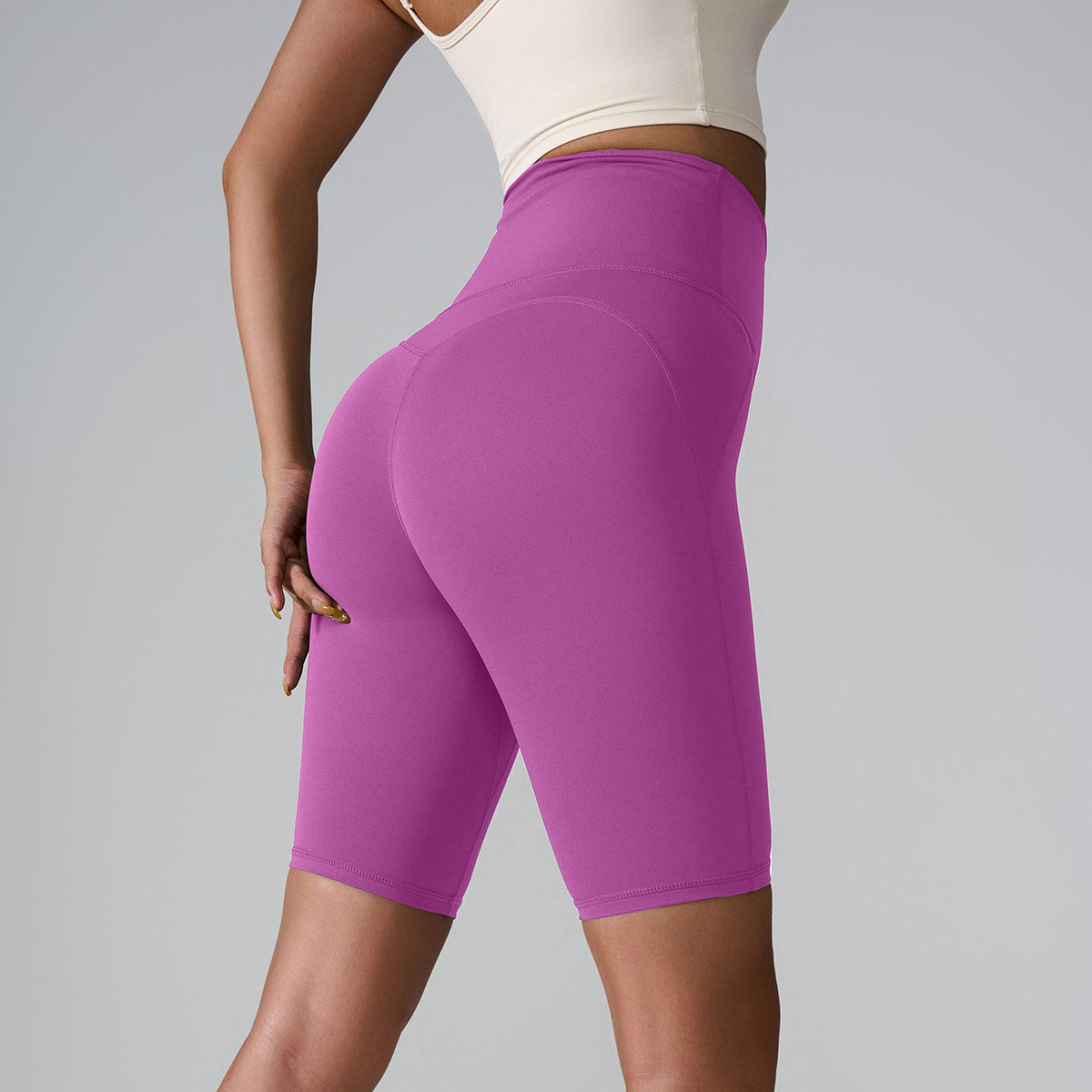 Purple compression bike shorts with high-rise waistband and seamless construction