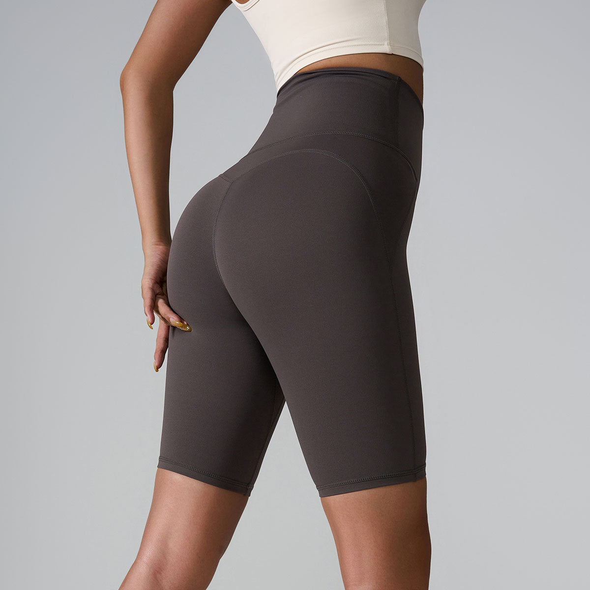 Charcoal gray high-waisted athletic shorts with smoothing compression fabric