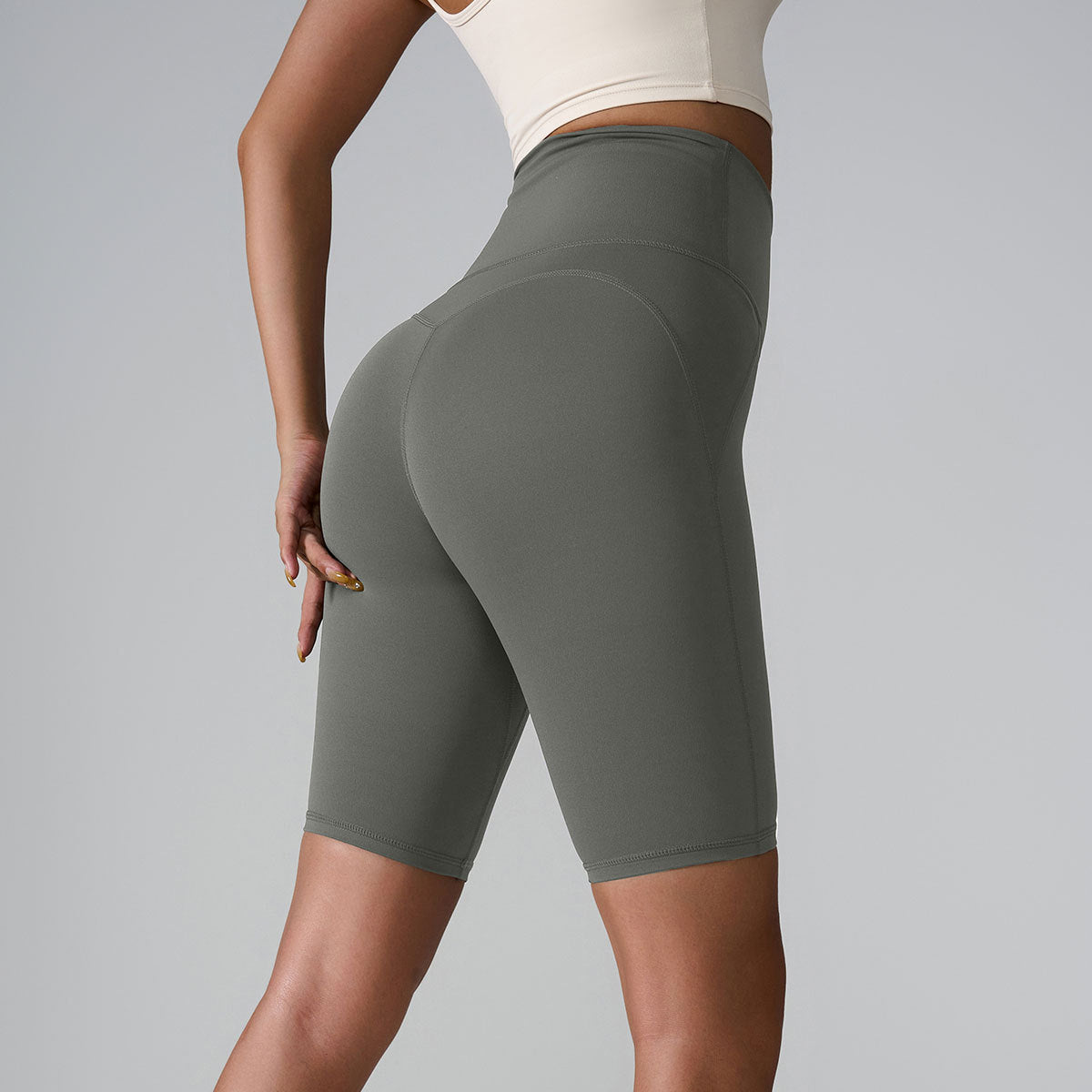 Olive and taupe compression shorts showing high waistband and seamless design details