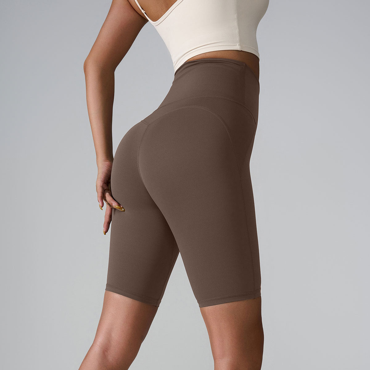 Olive and taupe compression shorts showing high waistband and seamless design details