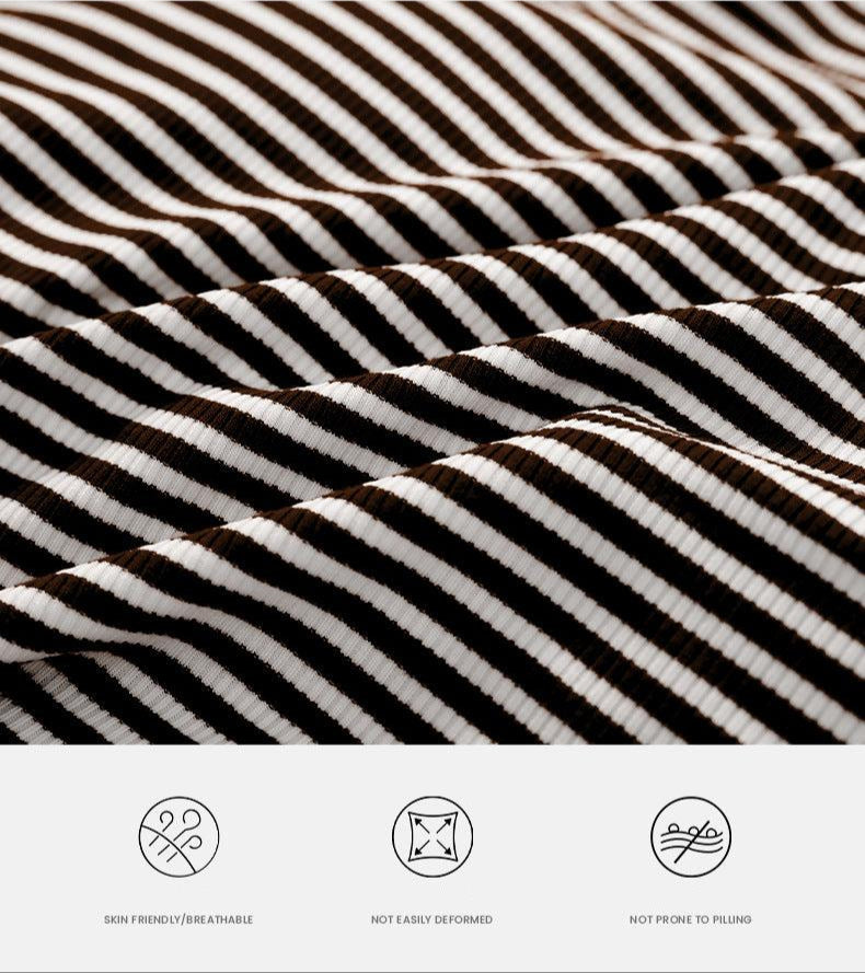 Close-up of black and white striped ribbed fabric texture showing skin-friendly, non-deforming material with anti-pilling properties