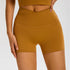 Caramel colored compression shorts with crossover waistband and buttery-soft fabric