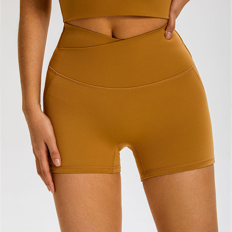 Caramel colored compression shorts with crossover waistband and buttery-soft fabric