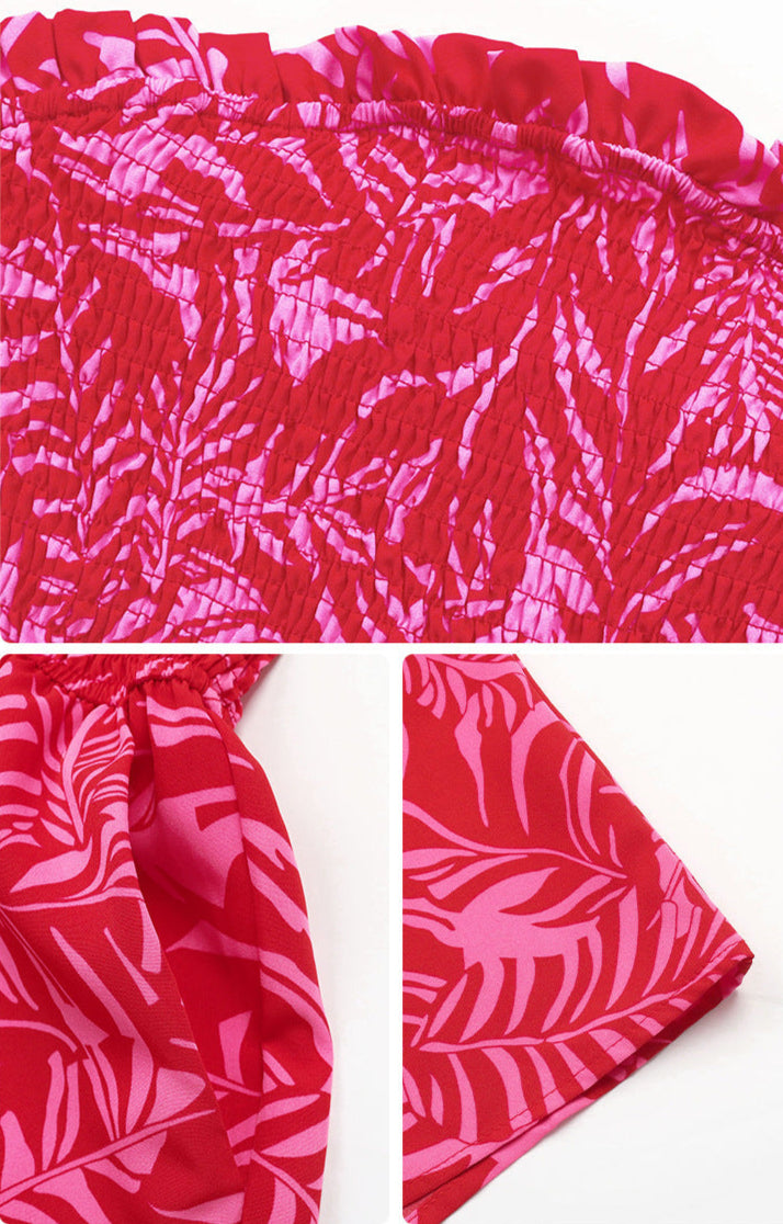 Close-up details of red tropical print fabric, smocked top, and hem stitching of the romper.