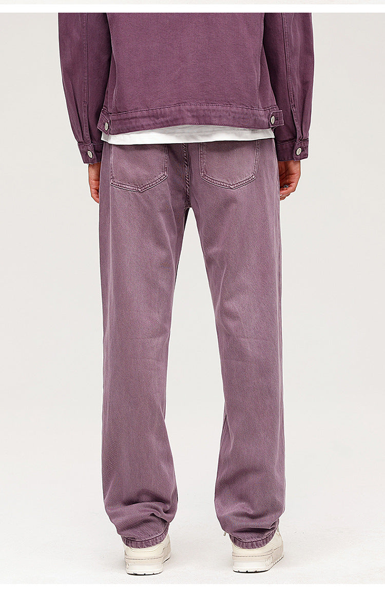 Purple wide-leg jeans with relaxed fit, shown with dark jacket and white sneakers