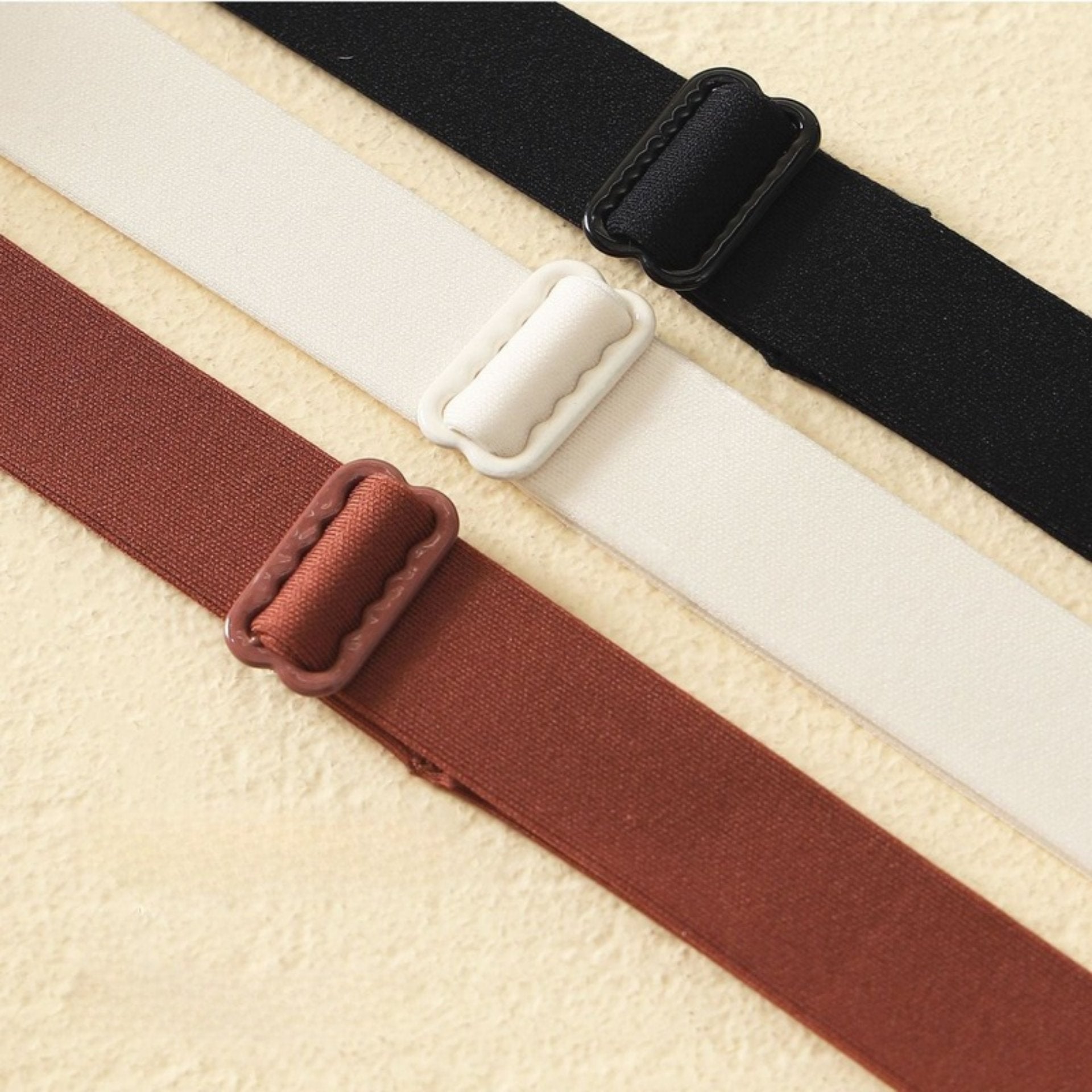 Adjustable high-stretch bra straps in black, white, and burgundy for extra comfort and support.