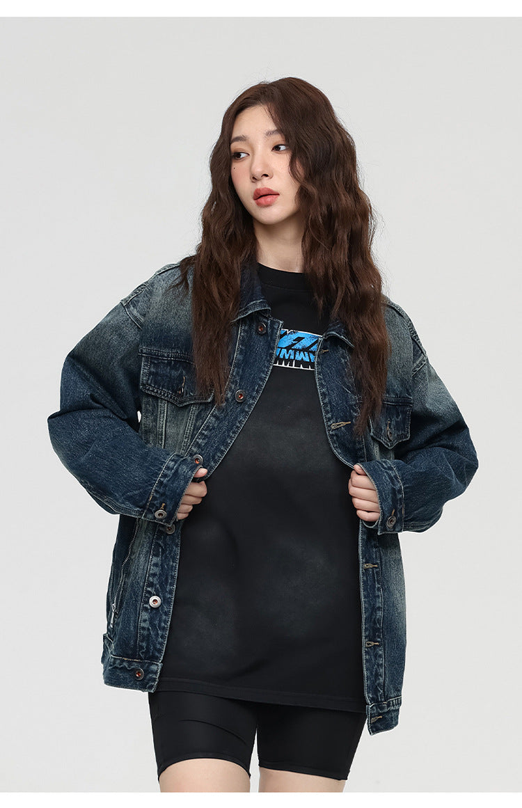Female model in denim jacket and black outfit showing front detail of jacket
