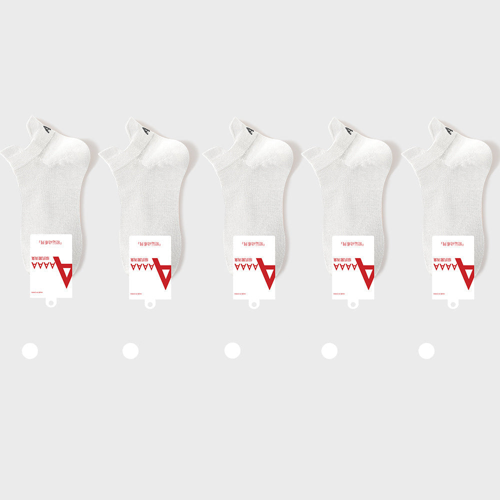 White antibacterial ankle socks with brand label and quality certification tags, retail presentation