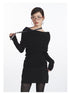 Black off-shoulder knit top with dramatic folded neckline, fitted waist, and long sleeves. Front detail with lanyard.