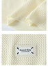 Sweater hem and label detail