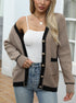 Black and beige knit cardigan with gold buttons, worn with white tank top and jeans