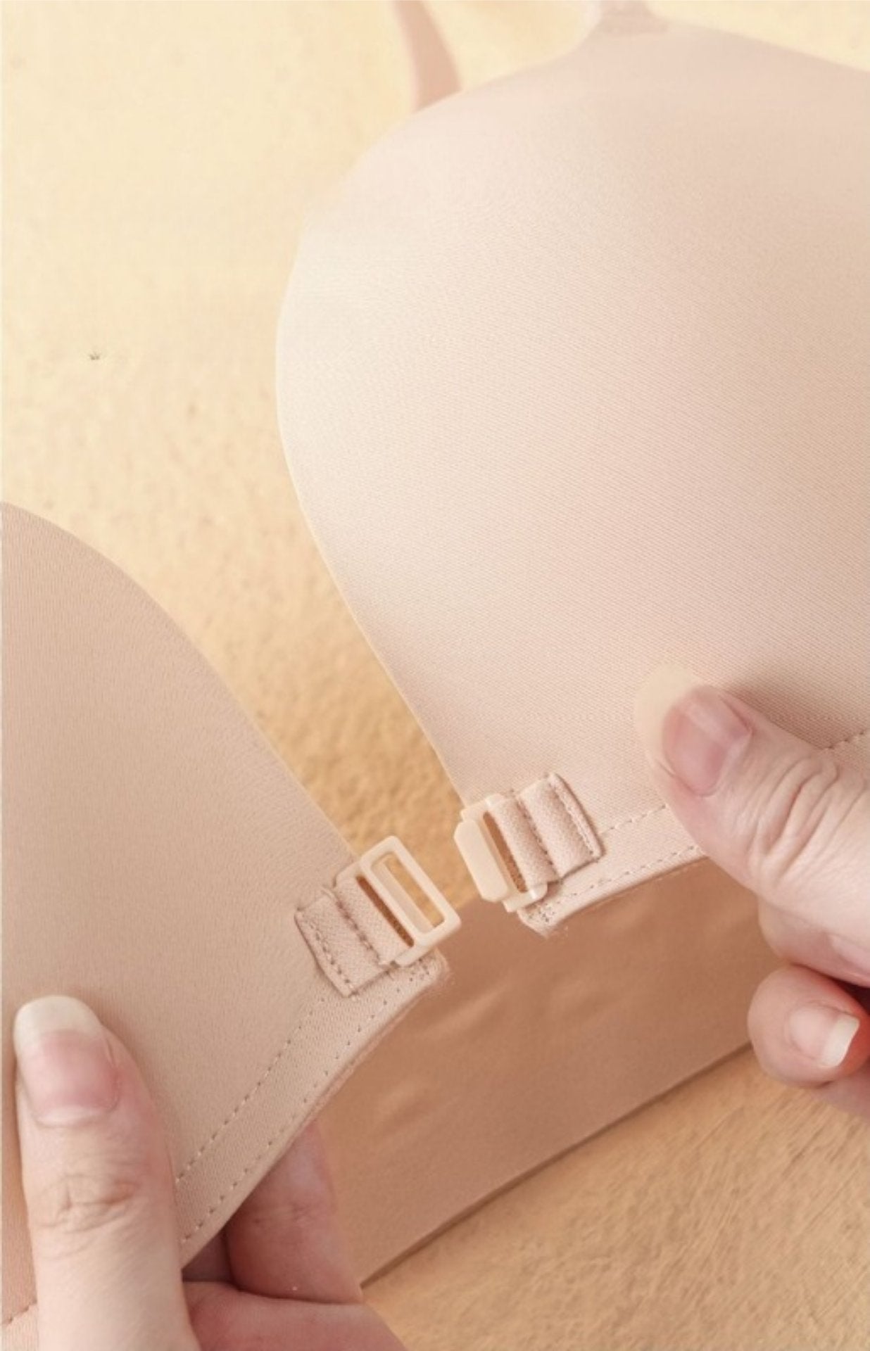 Close-up of front clasp for easy wear and secure fit in a seamless push-up bra.