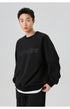 Side profile of the black "NoProblem" sweatshirt, highlighting its casual and versatile appeal