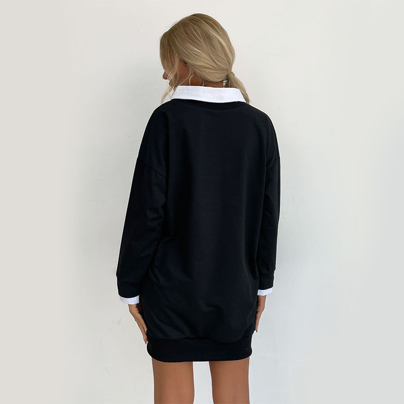 Back view of black California sweatshirt dress showing oversized fit