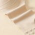 Close-up of an extended side panel on a seamless bra, made of high-stretch, breathable fabric for smooth back support.