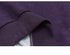 Detailed close-up of ribbed hem and stitching on a purple sweatshirt, highlighting premium fabric quality