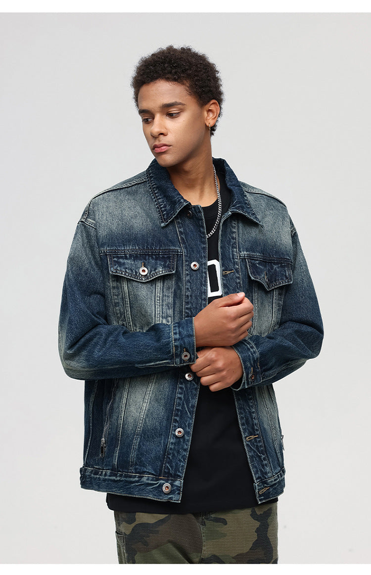 Close-up portrait of male model in denim jacket and black t-shirt