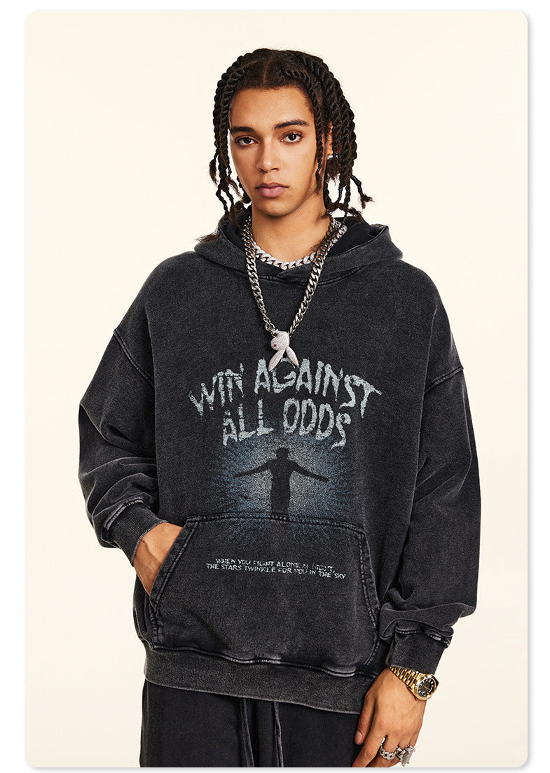 Rear view of model in black hoodie with braided hair, showing NE2C logo