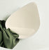 Close-up of a 3D breathable bra pad, designed for natural shaping and support.