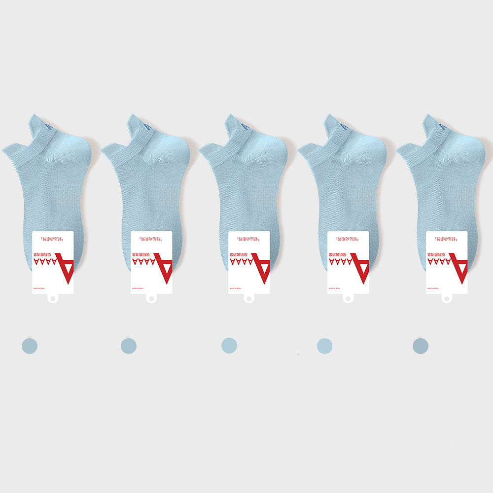 Blue antibacterial ankle socks with brand label and quality certification tags, retail presentation