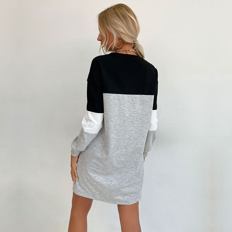Back view of color-block sweatshirt dress, blonde hair in ponytail