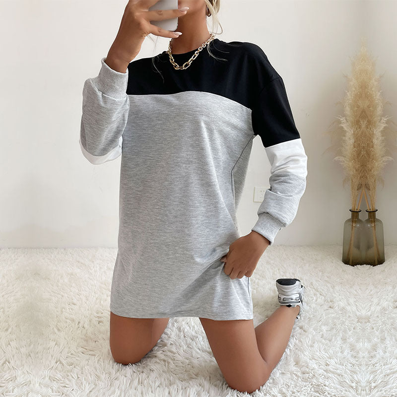 Sweatshirt dress, drinking from phone, white sneakers, gold chain necklace
