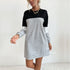 Color-block sweatshirt dress, black and white, gold accessories.
