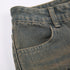 Detail shot of gray jeans waistband and pocket construction with worn-in wash effect
